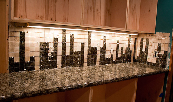 two tones of tile in a deliberate arrangement can turn your backsplash