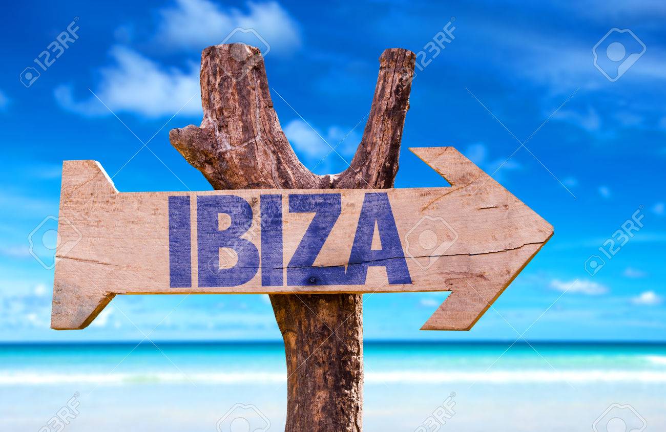 Ibiza Sign With Arrow On Beach Background Stock Photo Picture And
