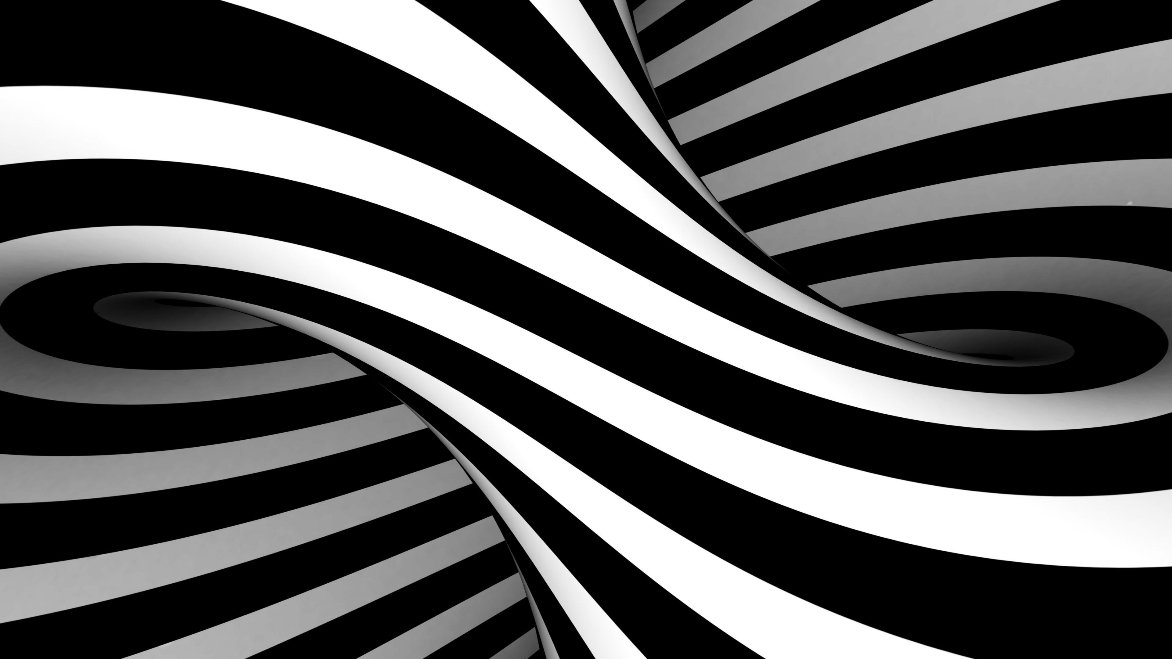 A swirling abstract pattern of black and white stripes creates a visually striking optical illusion