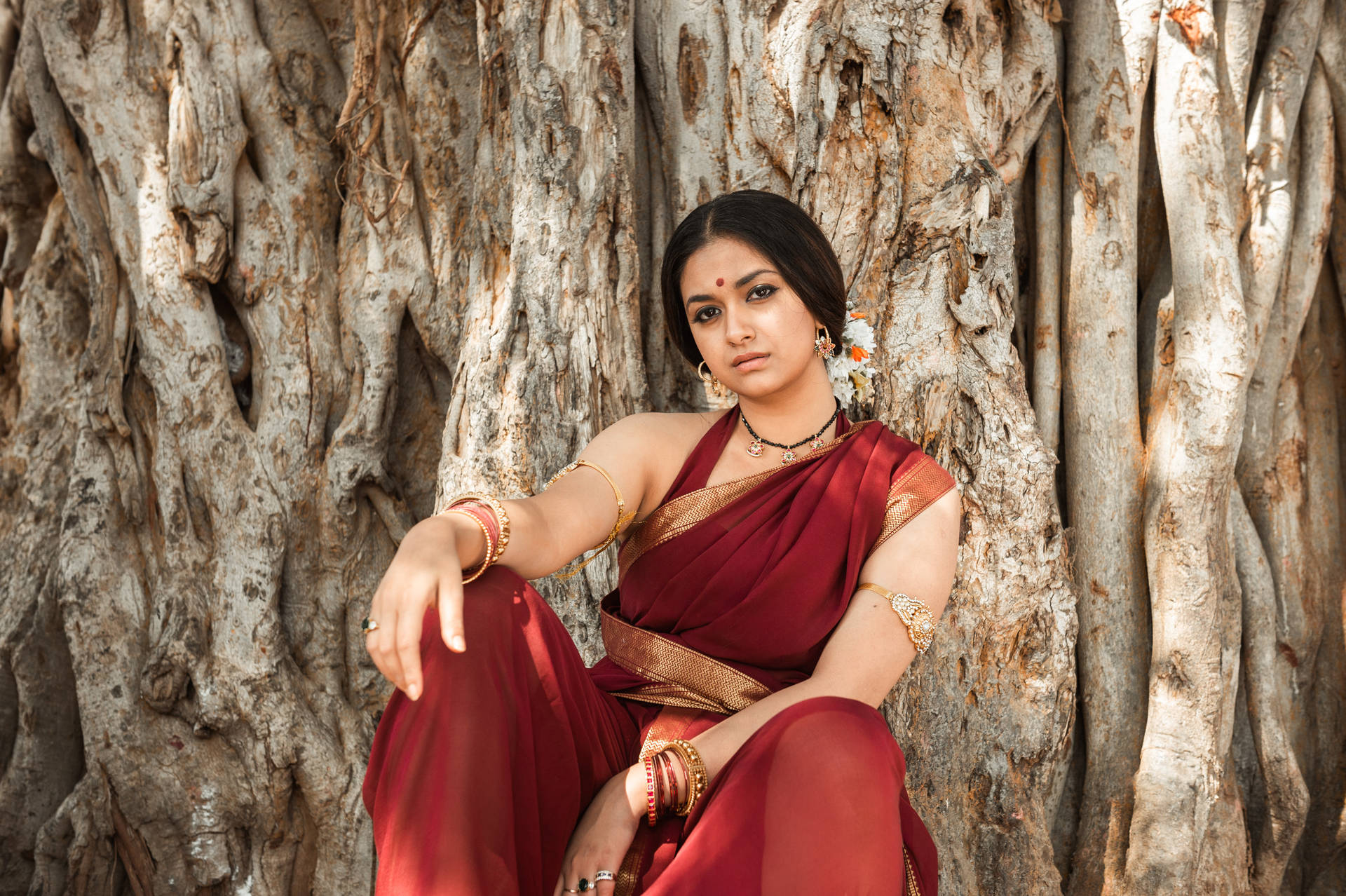 Captivating Keerthi Suresh In Elegant Saree Against An Wallpaper
