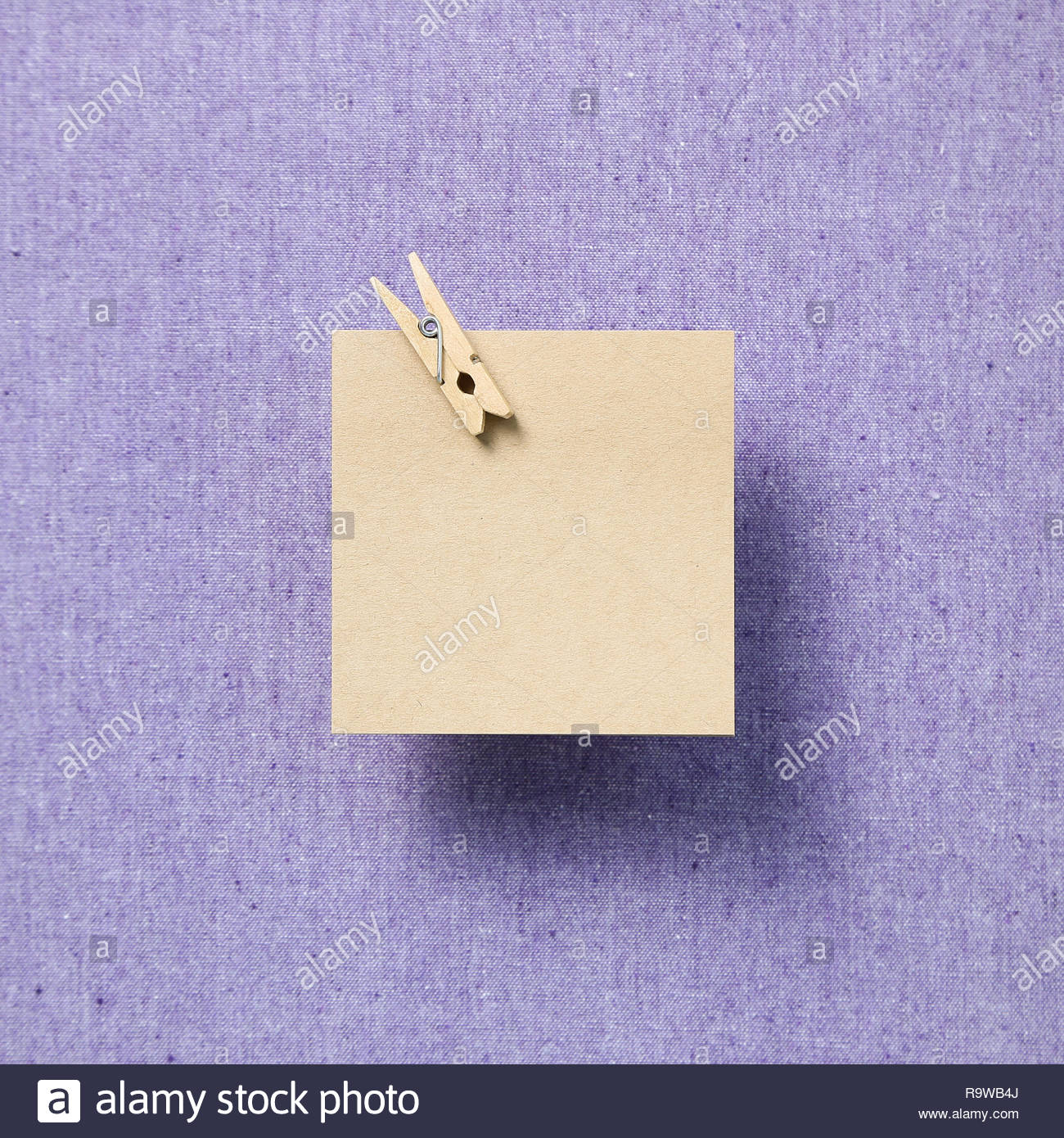 Empty Memo Paper Sticky Notes On Purple Fabric Background Stock