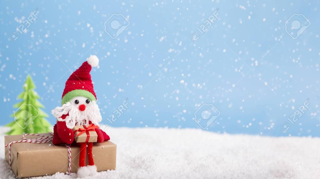 Winter Wallpaper Santa Sitting On Christmas Gift Near Tree Over
