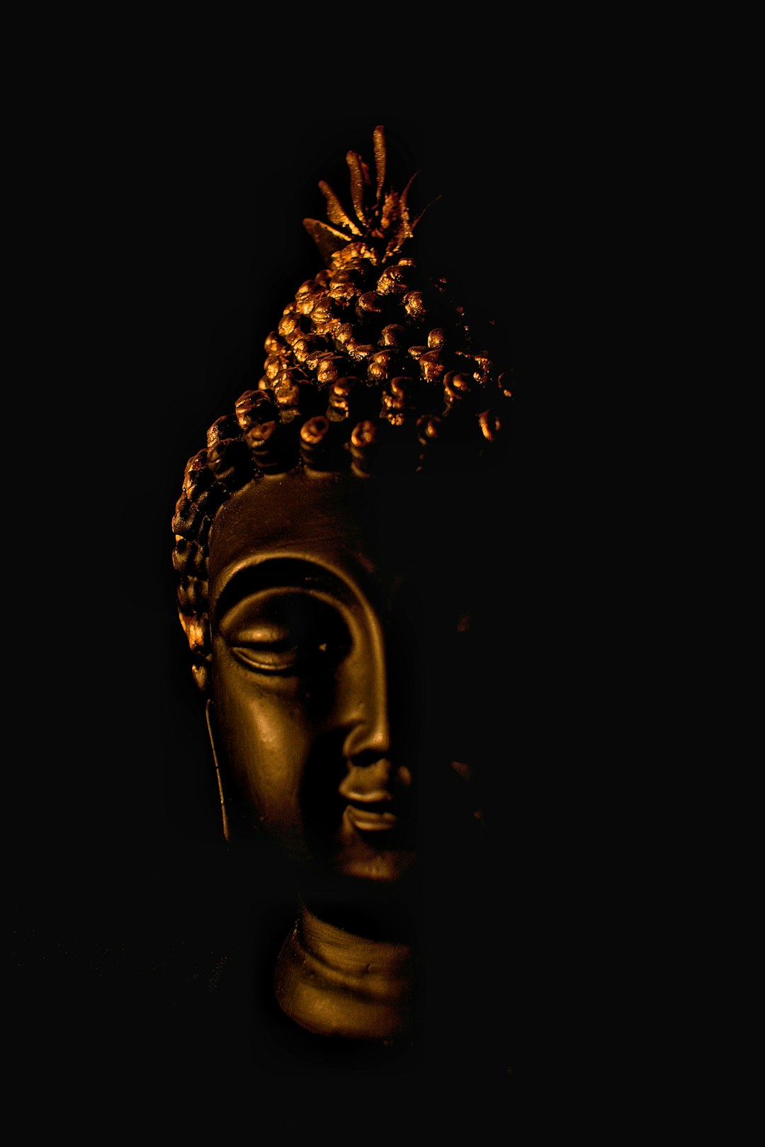 Serene Buddha Statue on Dark Background