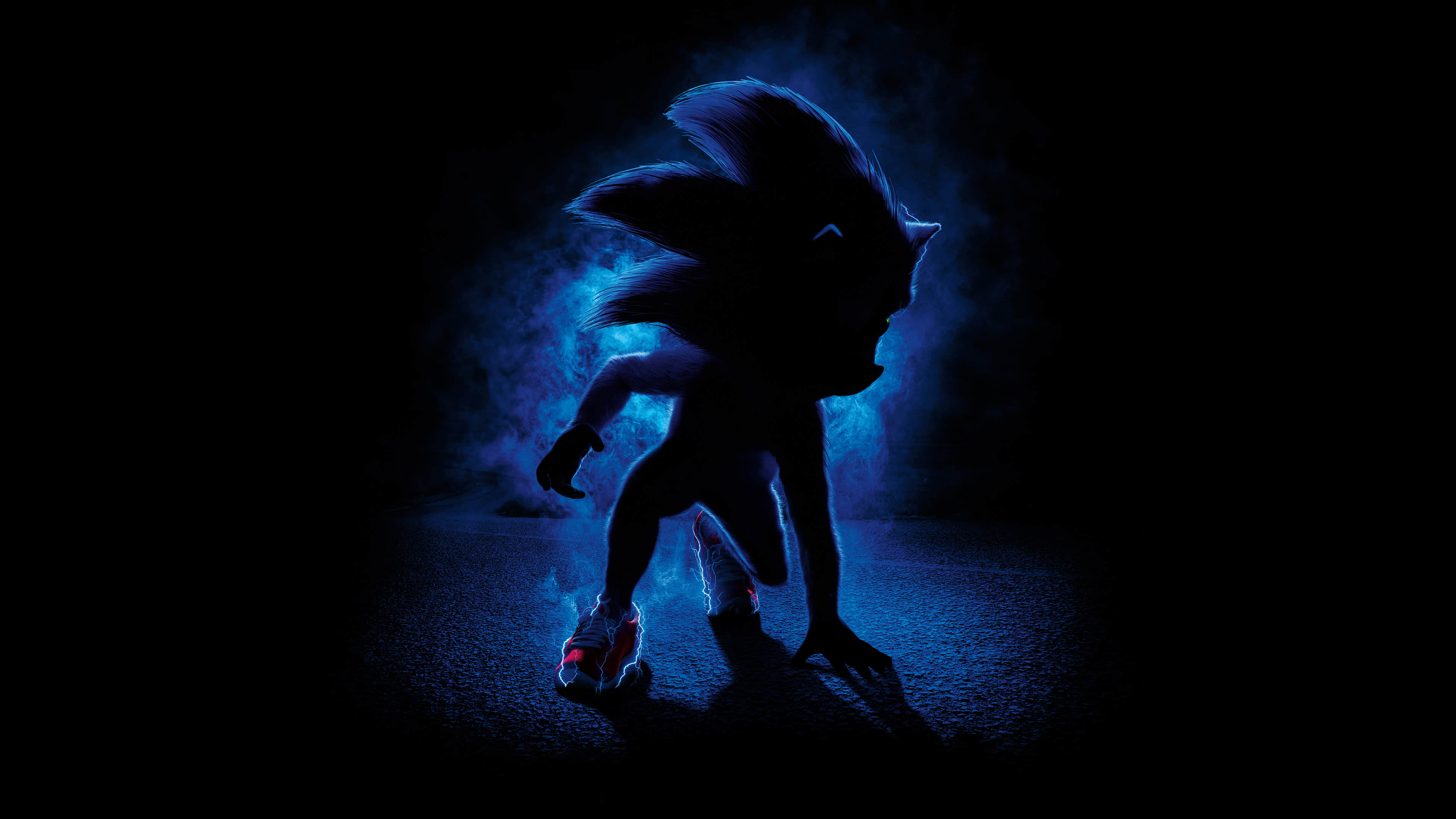 A dark, dynamic image of Sonic the Hedgehog in a runner's stance, radiating blue energy