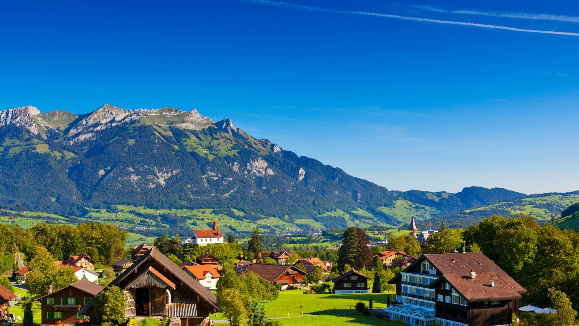 Scenic Swiss Alps Village Wallpaper
