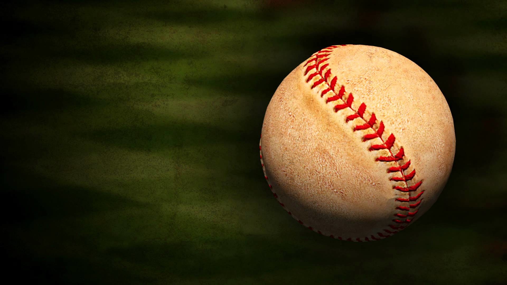 A worn, vintage baseball against a blurred green backdrop, evoking a sense of nostalgia and the timeless appeal of the sport