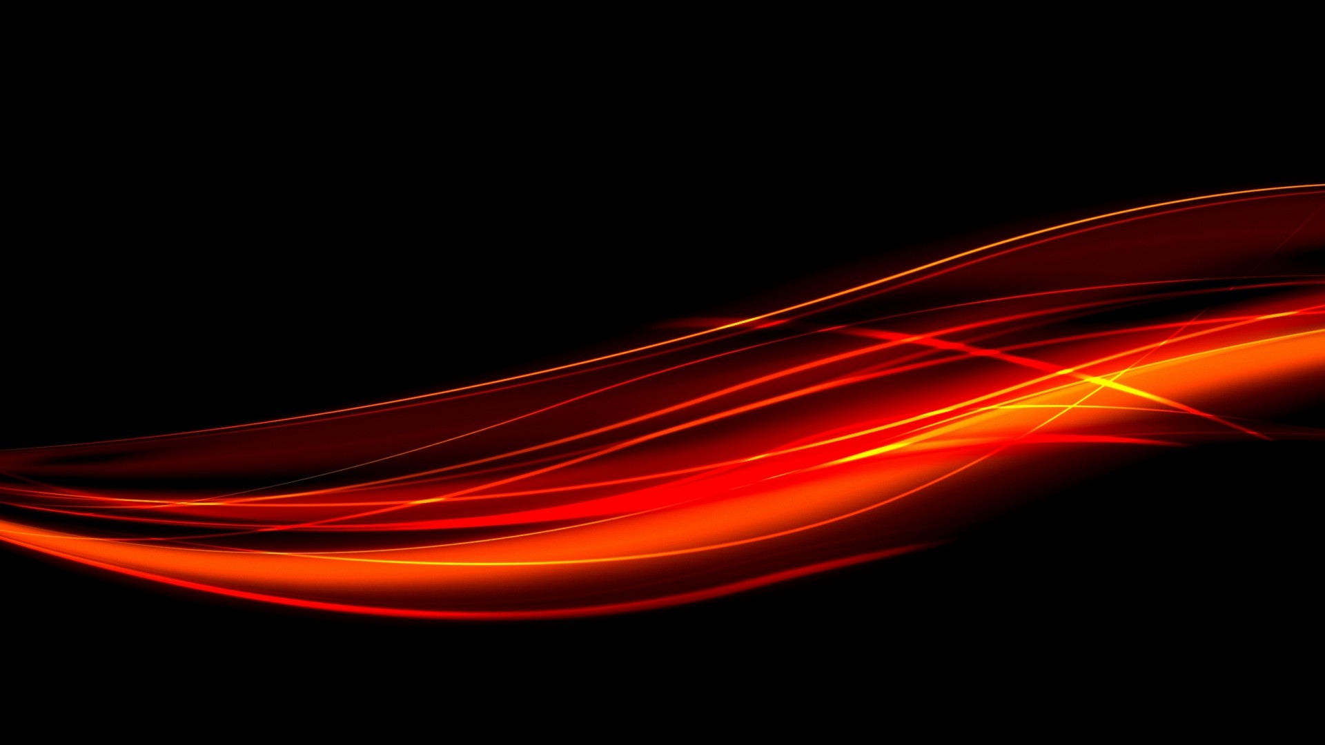 Abstract red and orange light streaks on a black background, creating a cool and dynamic wallpaper