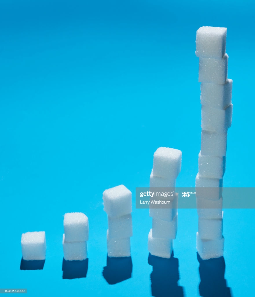 Sugar Cubes Forming Ascending Bar Graph On Blue Background High