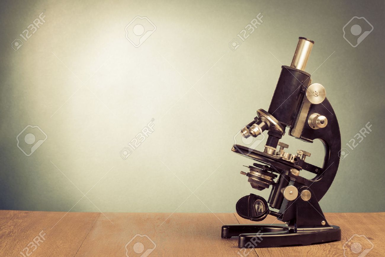 Vintage Microscope On Table For Science Background Stock Photo