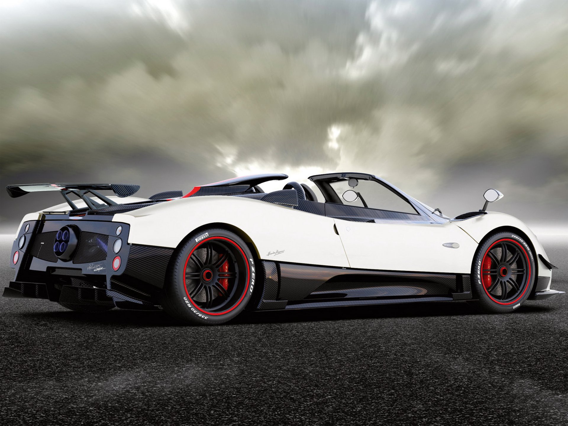 A white Pagani Huayra Roadster supercar parked on a tarmac with dramatic clouds overhead