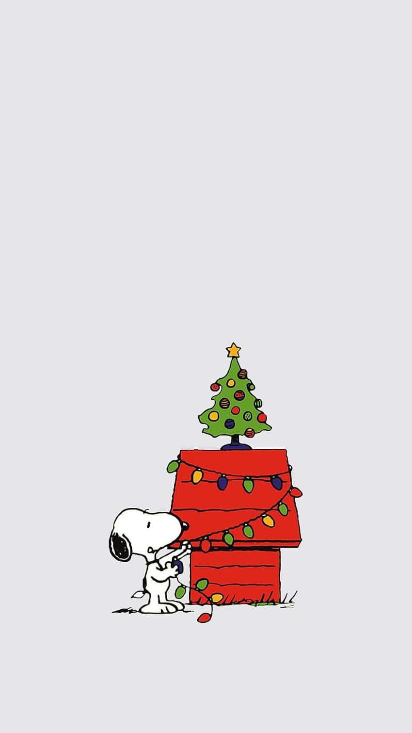 Snoopy And His Dog Are Standing Next To A Christmas Tree