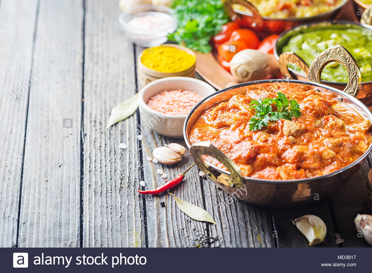 Different Bowls With Assorted Indian Food On Dark Wooden