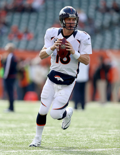 Peyton Manning Of The Denver Broncos Runs With
