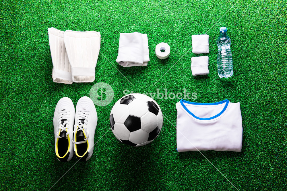 Soccer Ball Cleats And Various Football Stuff Against Artificial