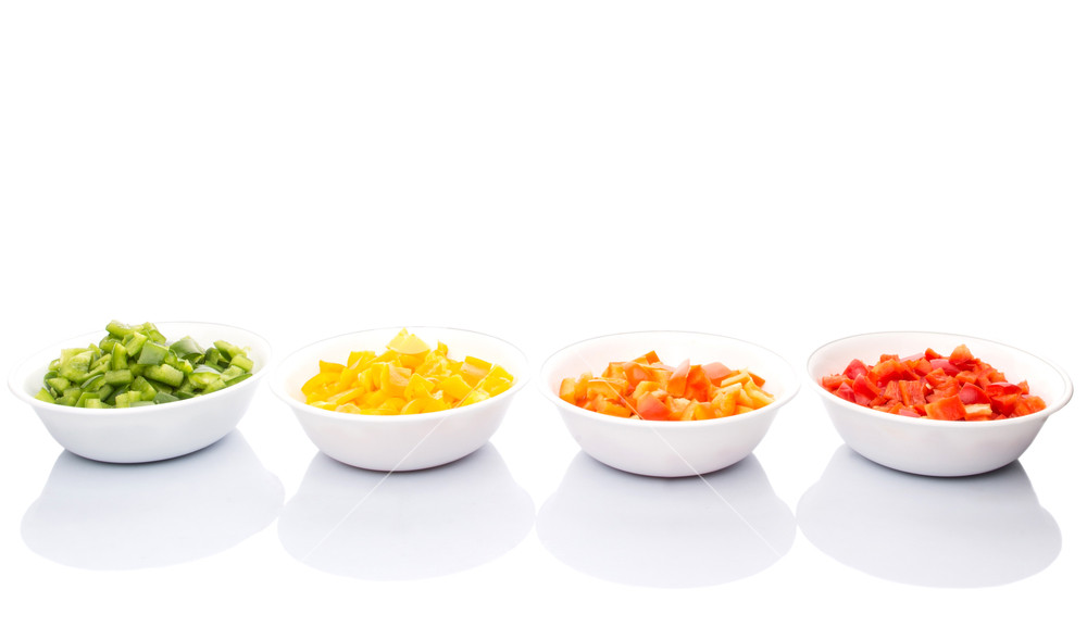 Chopped Colorful Bell Pepper In White Bowl Over Background