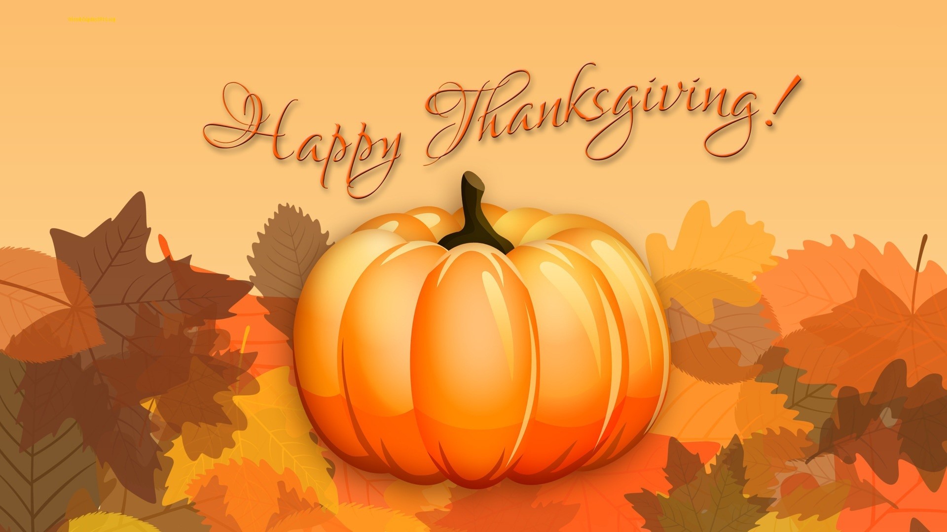 A vibrant pumpkin sits amidst a bed of autumn leaves, embodying the spirit of Thanksgiving