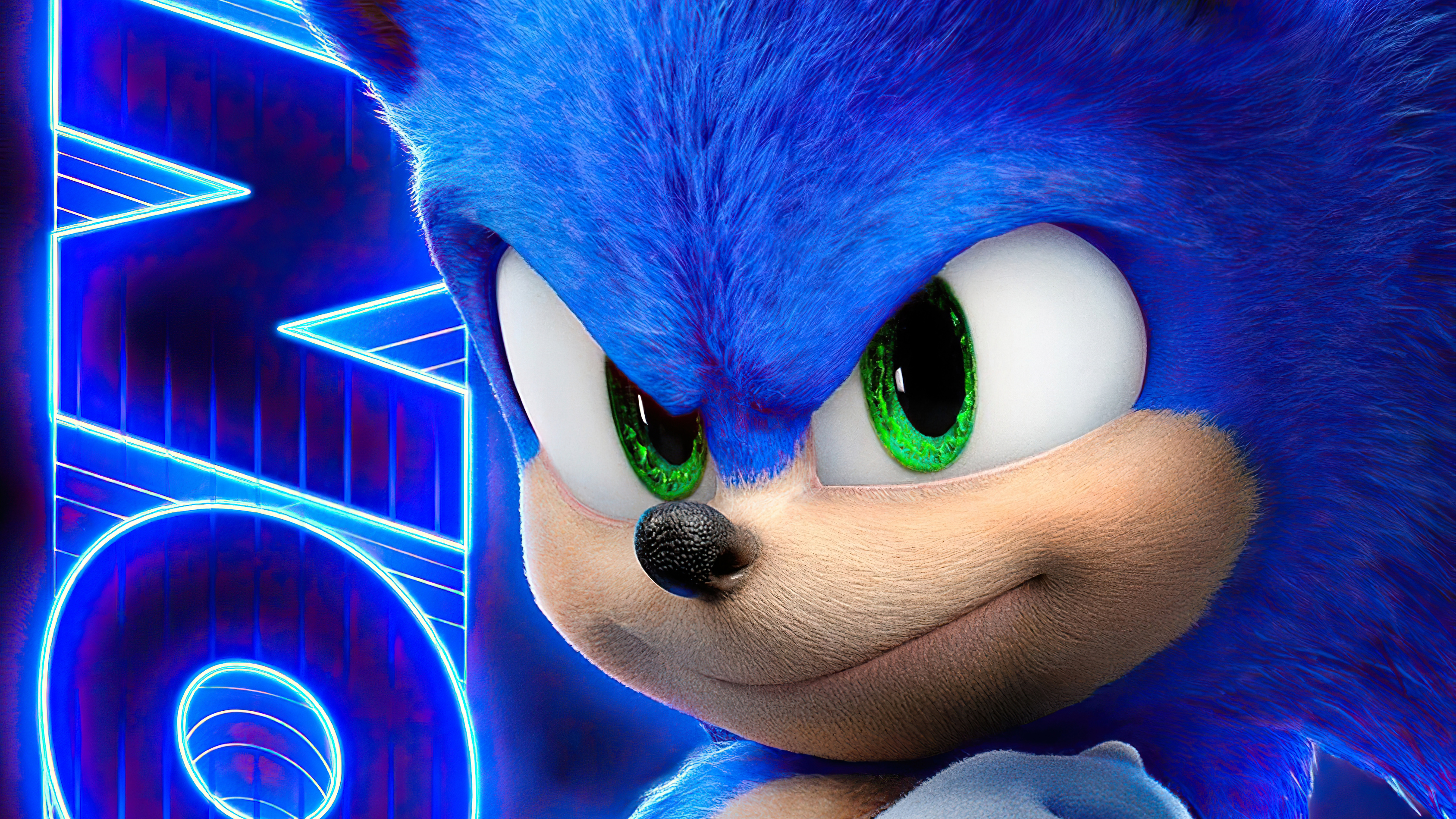 Close-up of Sonic the Hedgehog's face from the movie, with a neon 'Sonic' logo in the background