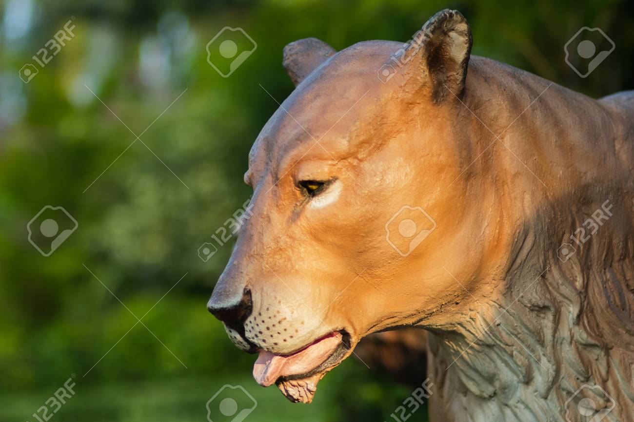 The Lioness Statue Looks So Tired With Blurry Background Stock
