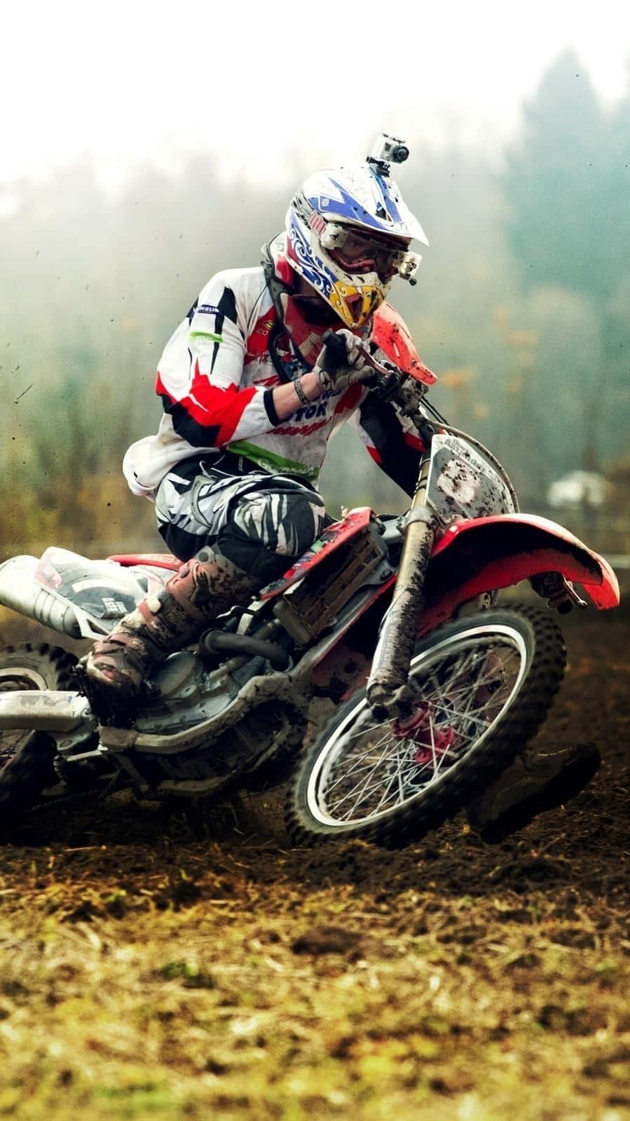 Caption Thrilling Ride Through The Mud Motocross Rider