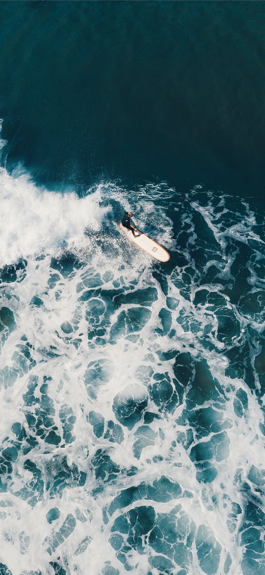 Person Surfing On Sea Waves During Daytime Iphone X Wallpaper