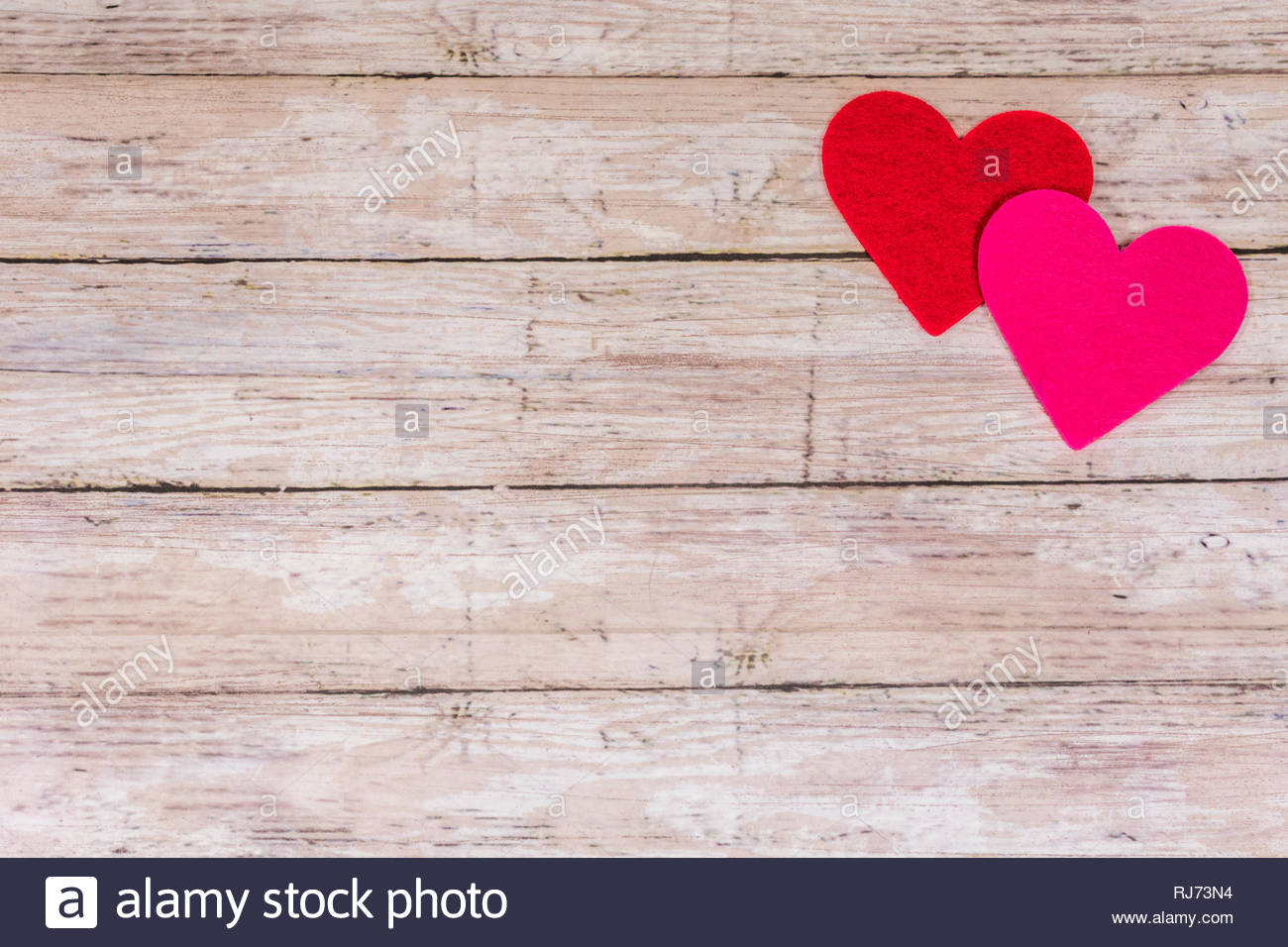 White Saint Valentines day background with red and pink hearts