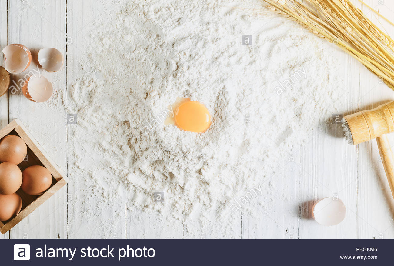 Baking Background With Cake Ingredients On White Wood From Above