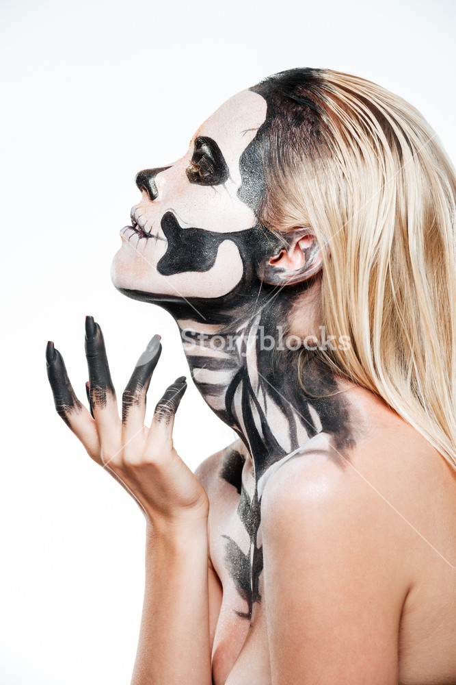 Profile Of Woman With Intimidating Halloween Makeup Over White