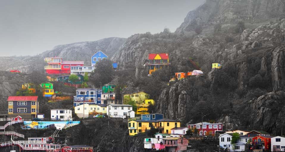 Multi colored homes along shoreline of St Johns Newfoundland and