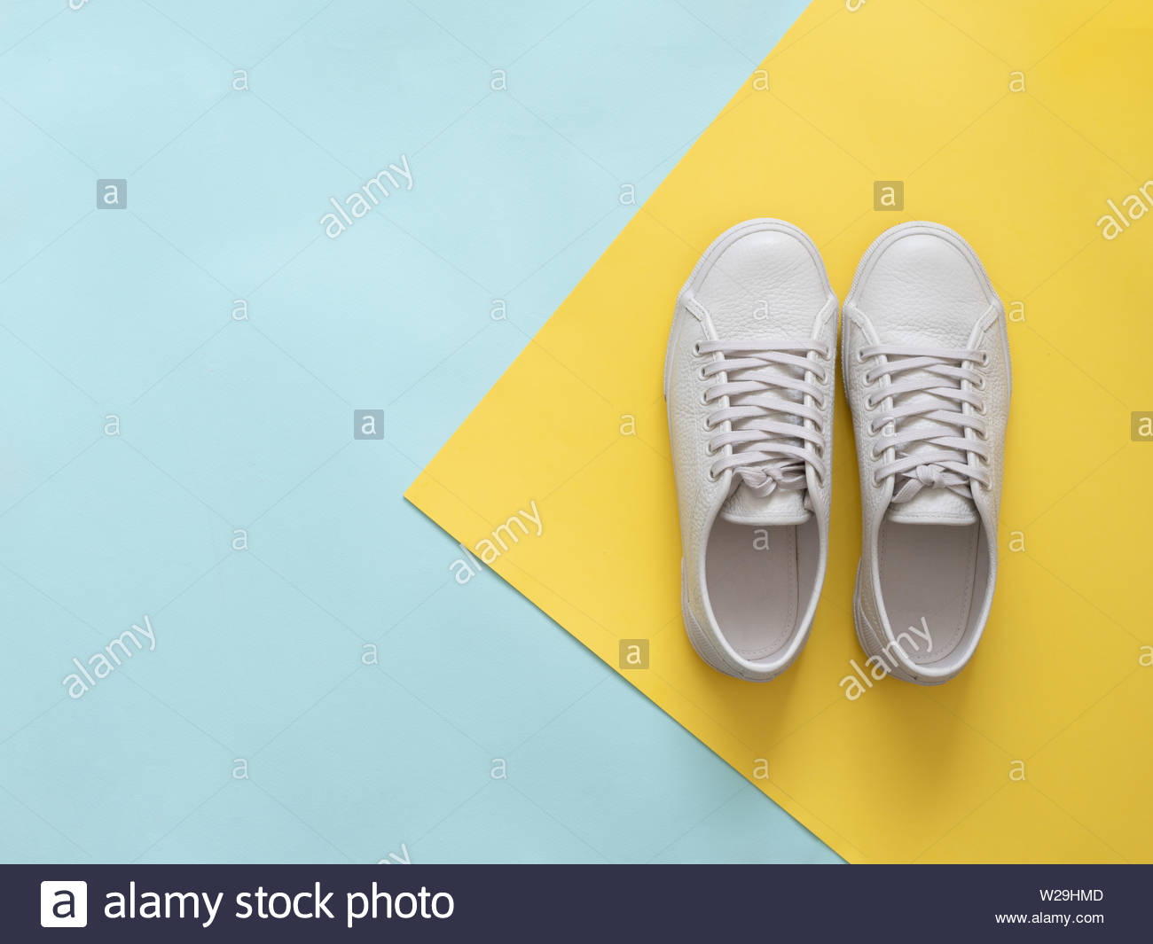 Free download White leather sneakers on blue and yellow background Pair ...