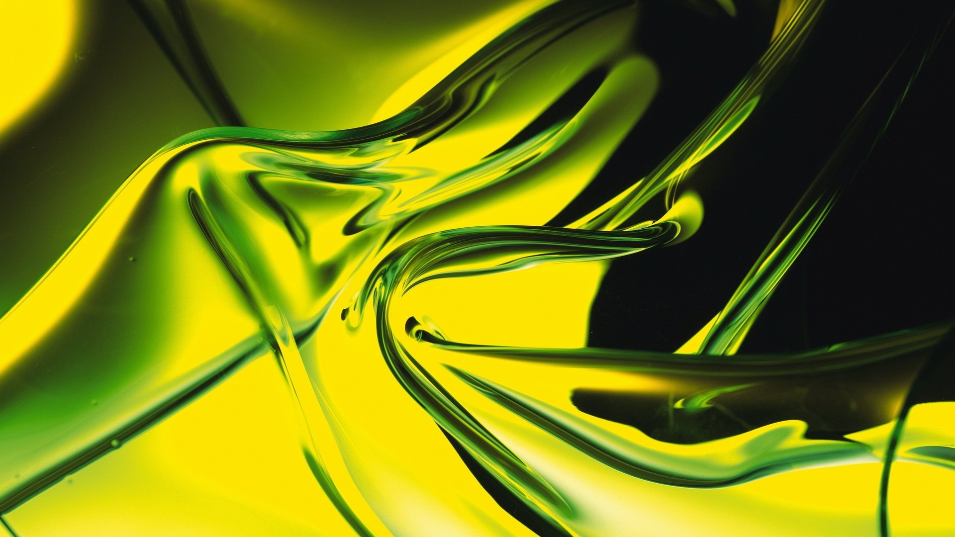 Abstract image with swirling yellow and green hues, resembling flowing liquid or fabric