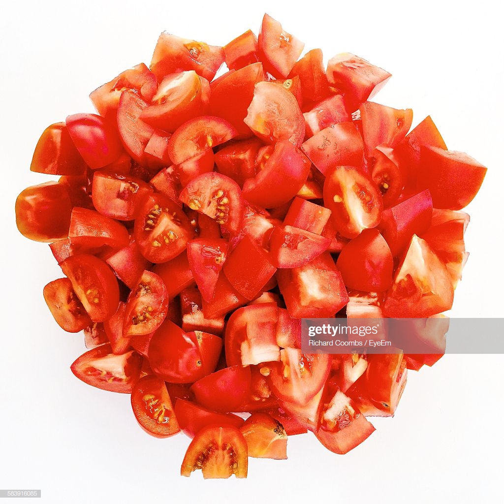 Closeup Of Chopped Tomatoes On White Background Stock Photo