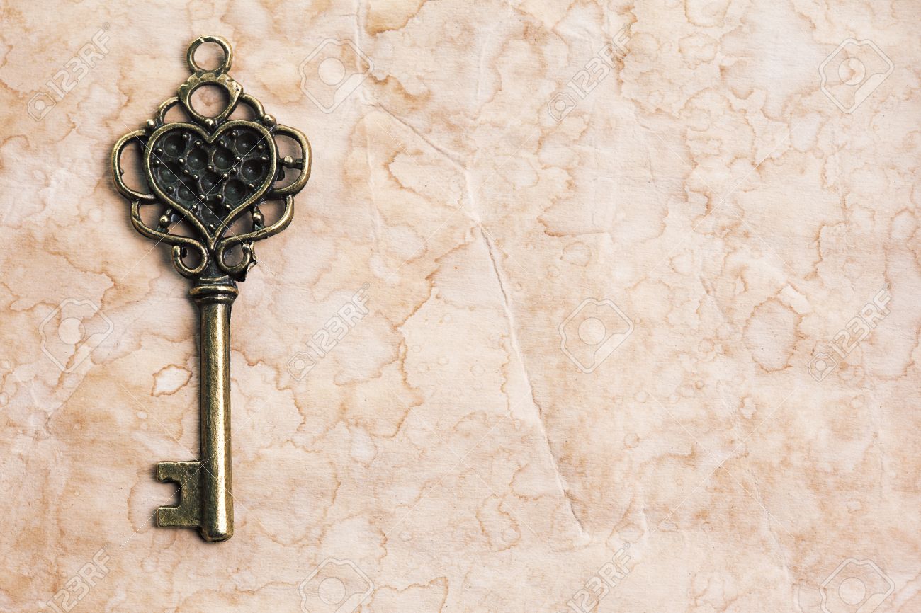 Vintage Key On Paper Background Stock Photo Picture And Royalty