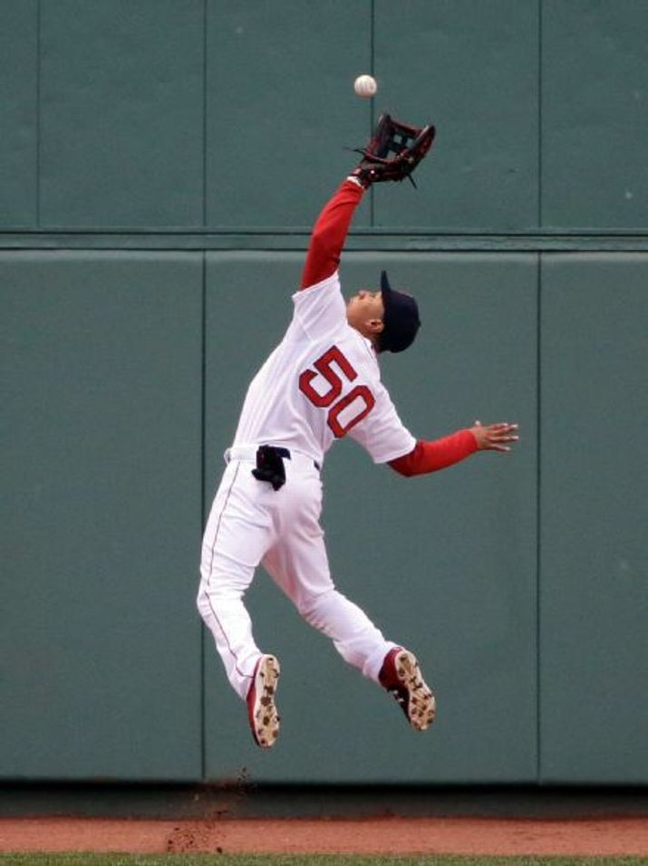Boston Red Sox Center Fielder Mookie Betts Catches A Deep Fly Ball