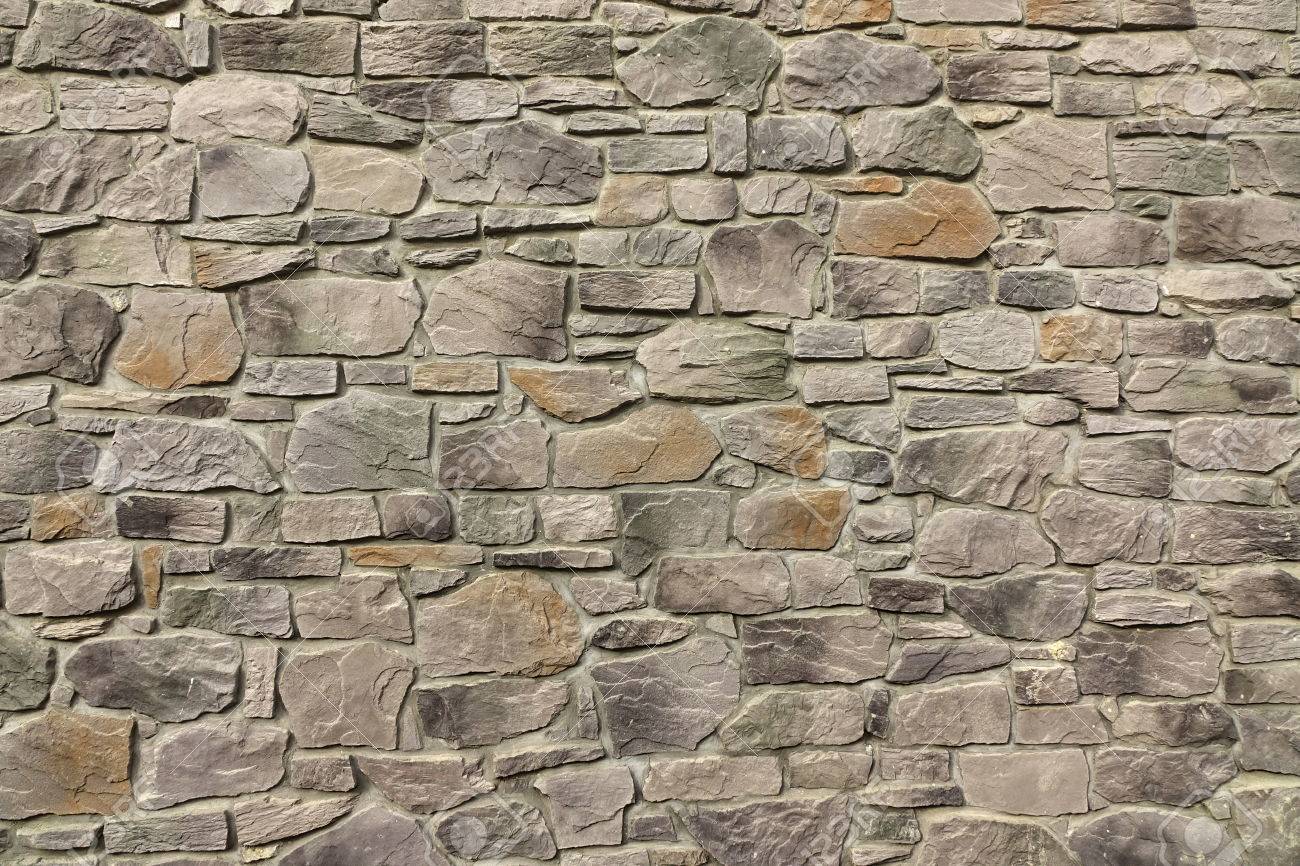 Modern Textured Grey Yellow Stonewall Made From Flagstone And