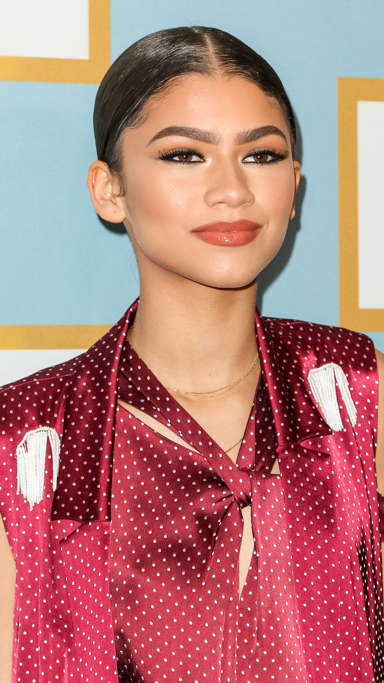 Zendaya with a ponytail and shiny lips Mobile Wallpaper 25016 750x1334