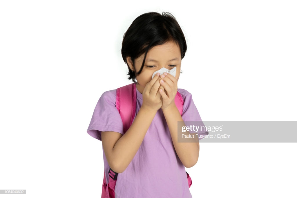 Girl Sneezing Against White Background Stock Photo Getty Image