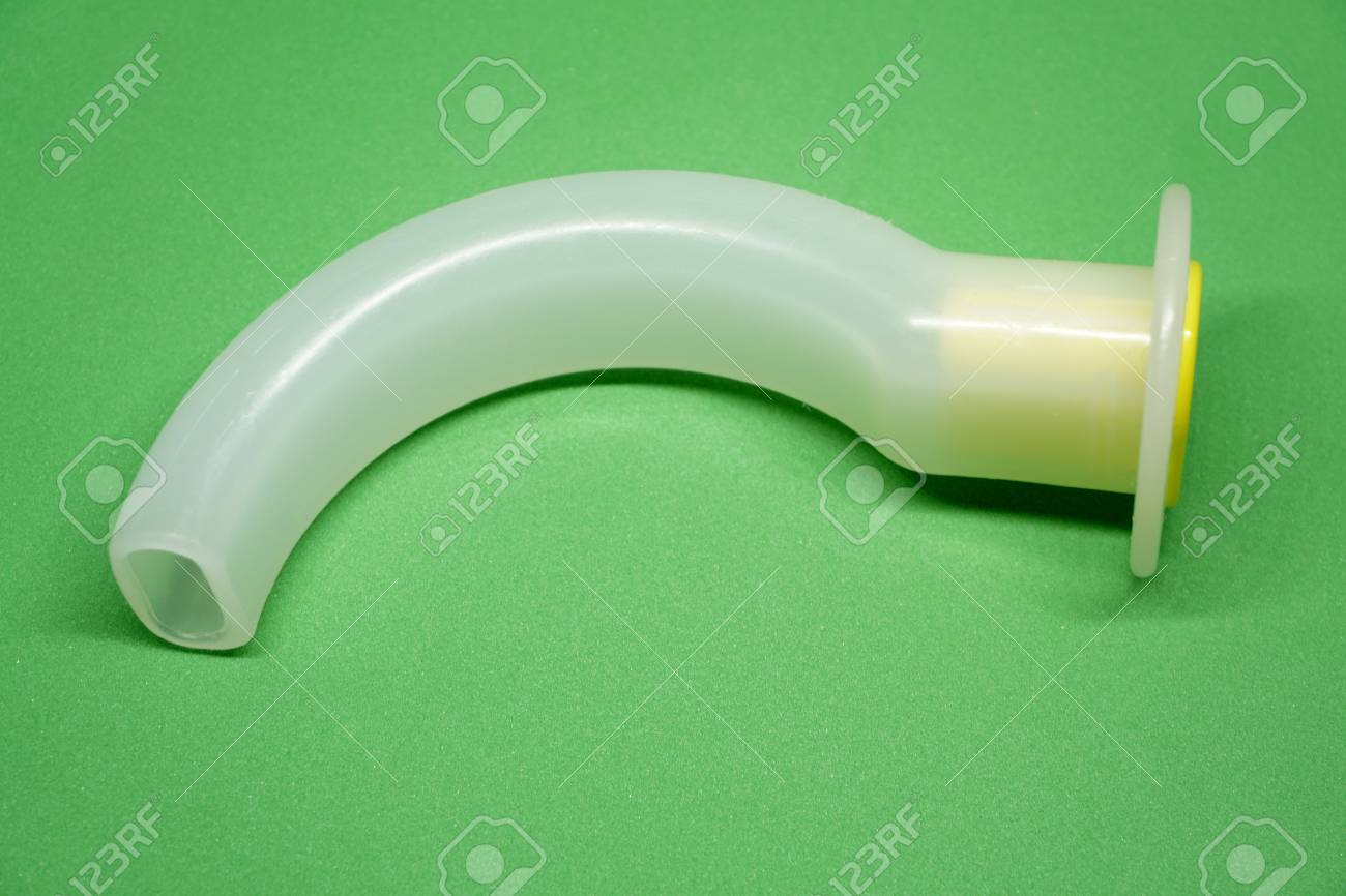 Oropharyngeal Airway Tube With Connector Isolated On Green