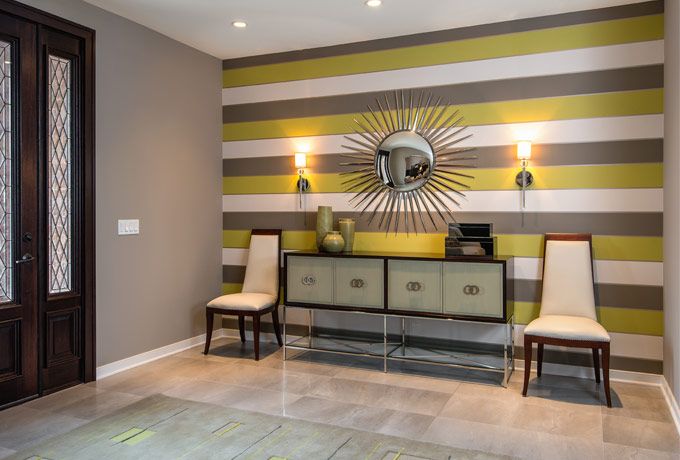 An Elegant Contemporary Foyer With Bold Horizontal Striped Wallpaper