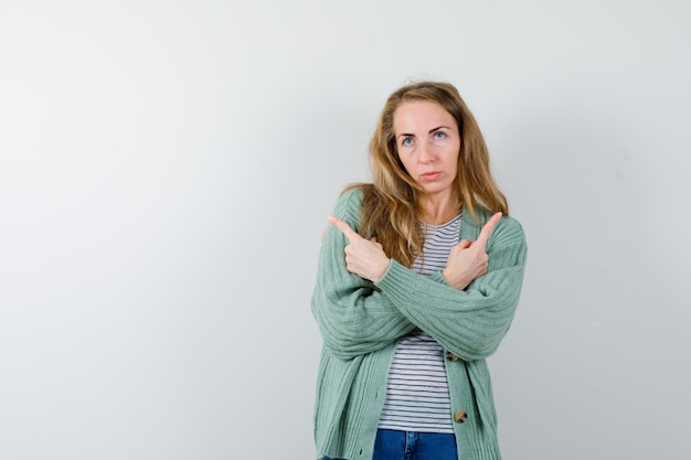 Expressive Young Woman Posing Studio Wallpaper