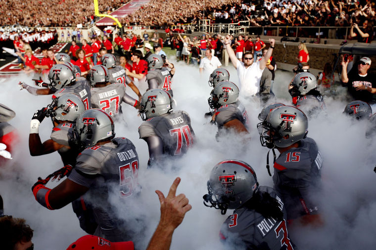 Texas Tech V Tcu Fball Eb Players Run On To The