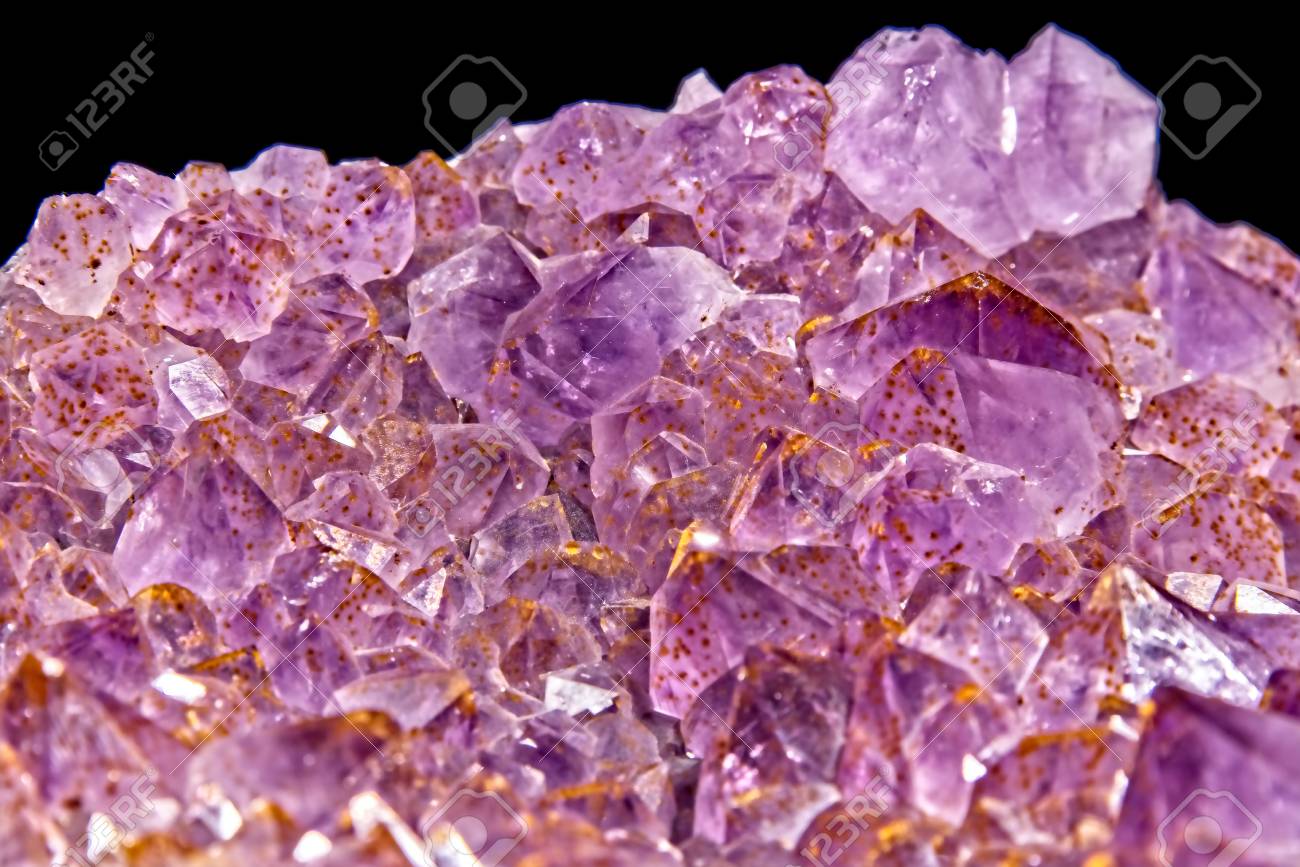 Purple To Pink Amethyst Crystal Geode Cut On Black Background