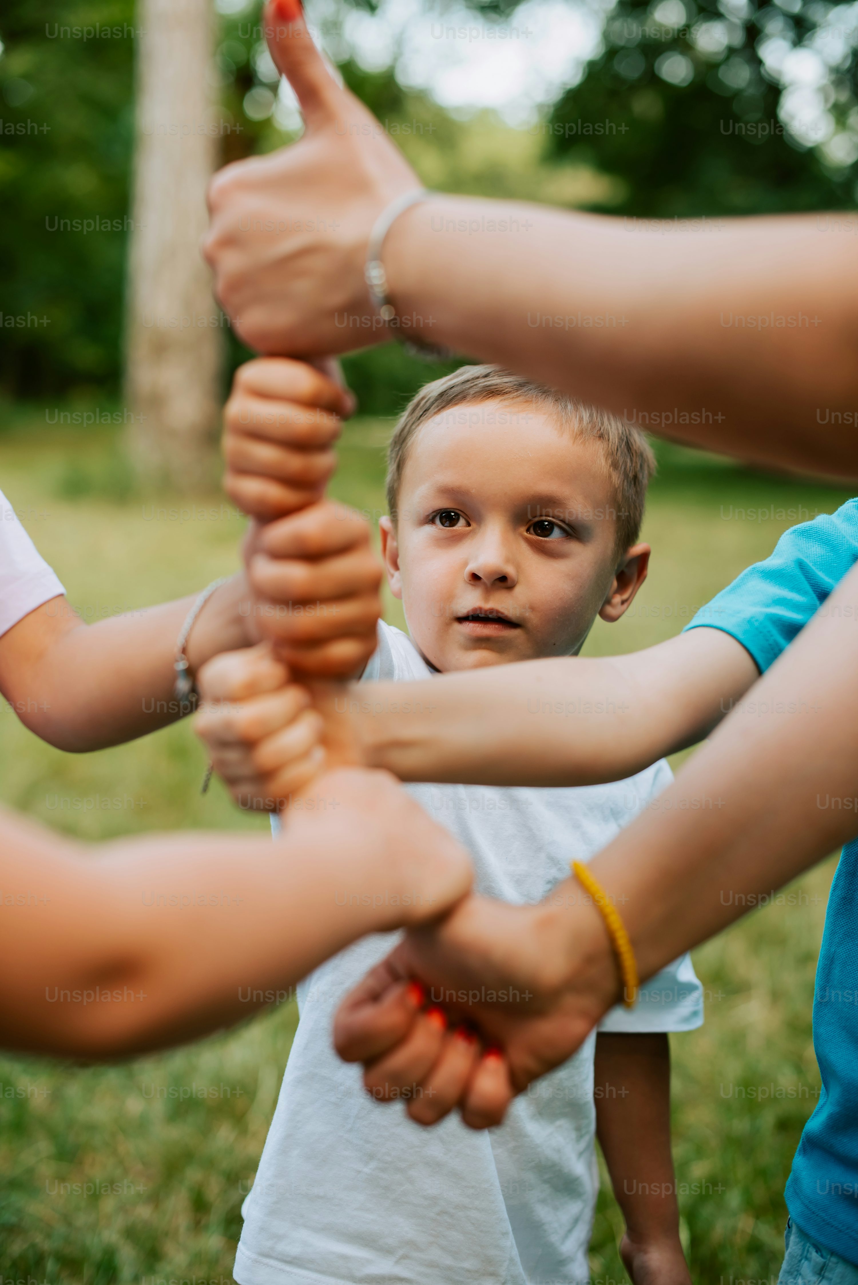 A Group Of People Standing In Circle With Their Hands Together Photo Wallpaper