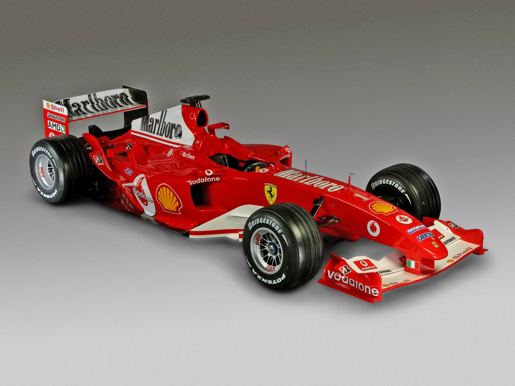 Grijze wallpaper met rode Formule 1 auto van Ferrari