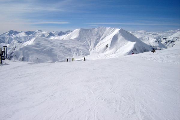 Ski Slope Of Gudauri Area With Snowy Kaukasus Mountains