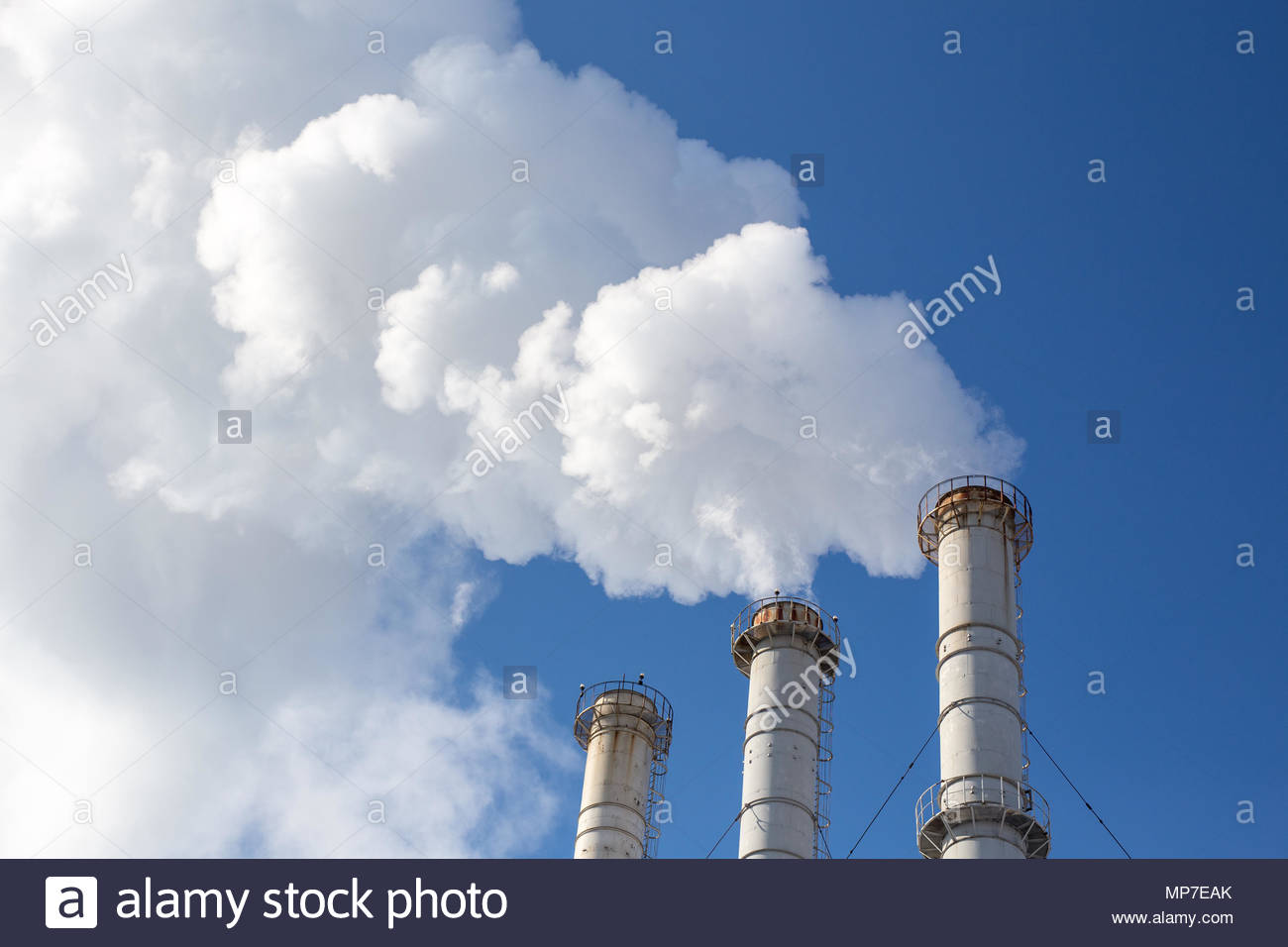 Smoking Pipes Making Clouds Against Blue Sky Background Dioxide