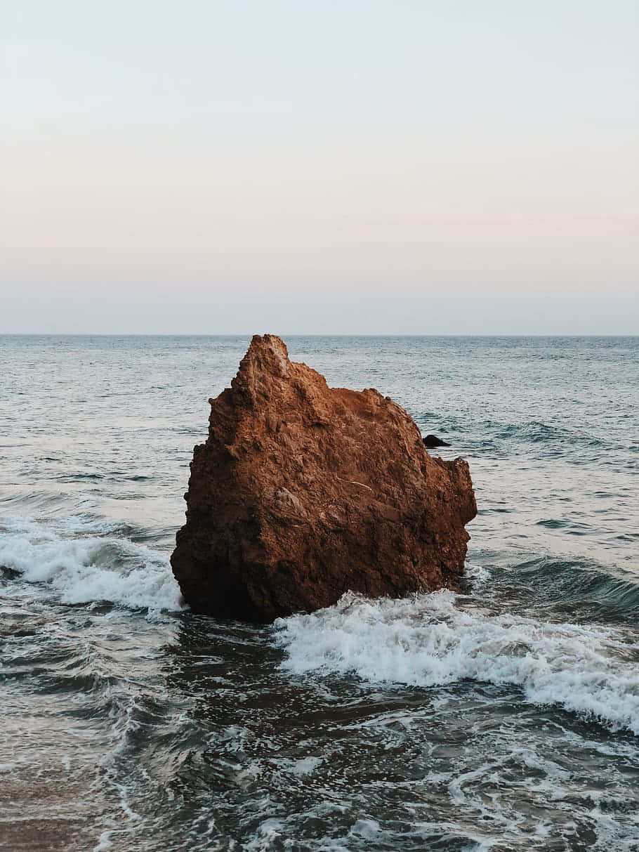 iPhone X Malibu Background With Big Stone Wallpaper