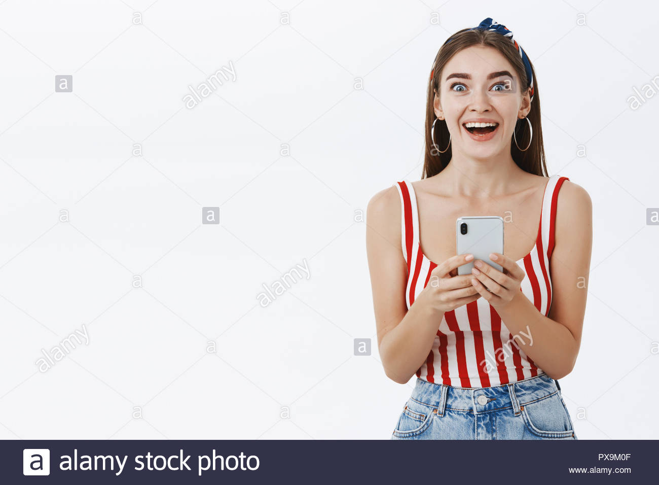 Girl Getting Excited Receiving Amazing News Via Smartphone Staring