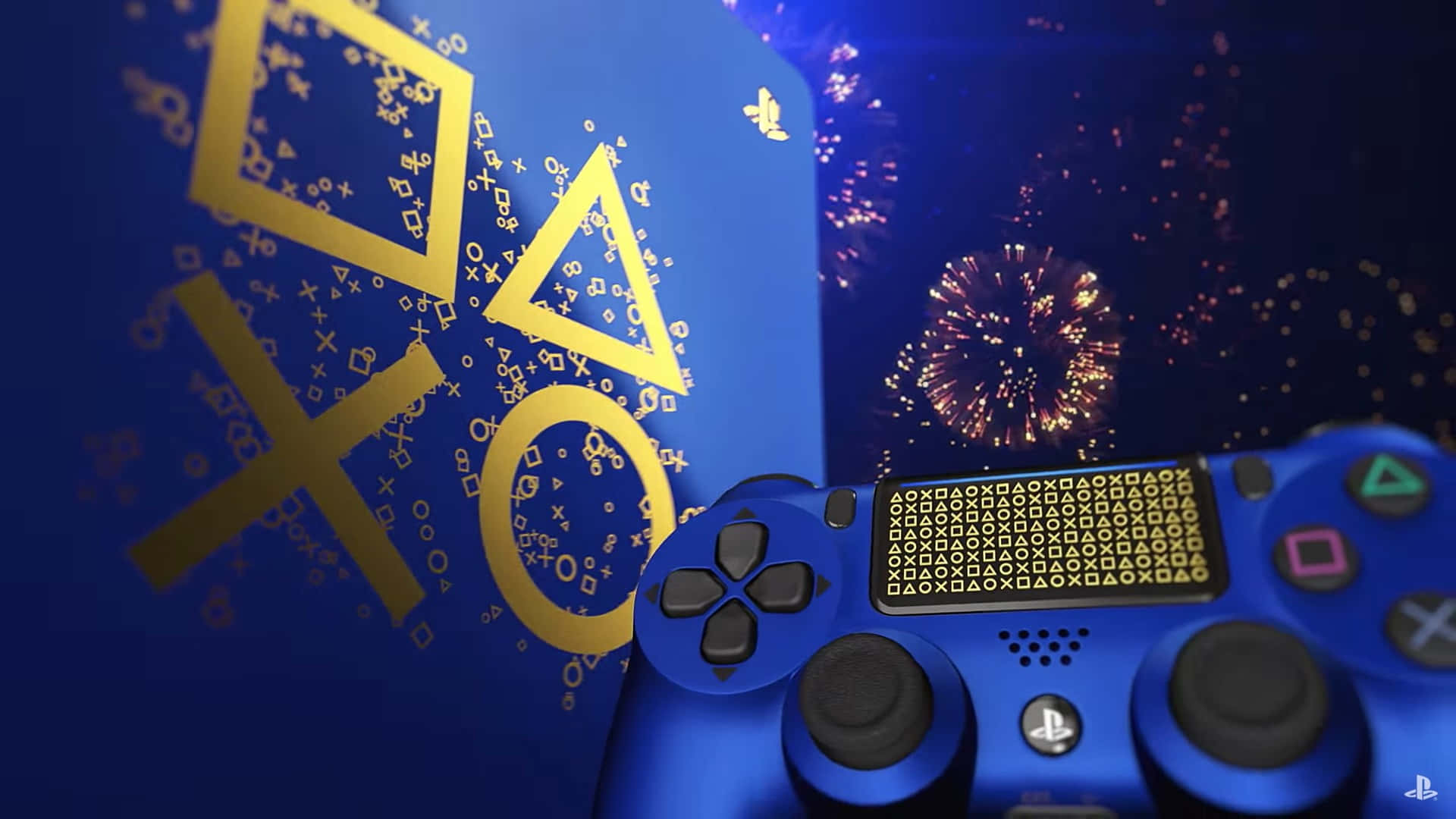 Close-up of a blue PlayStation 4 controller and console with gold PlayStation symbols, set against a backdrop of celebratory fireworks
