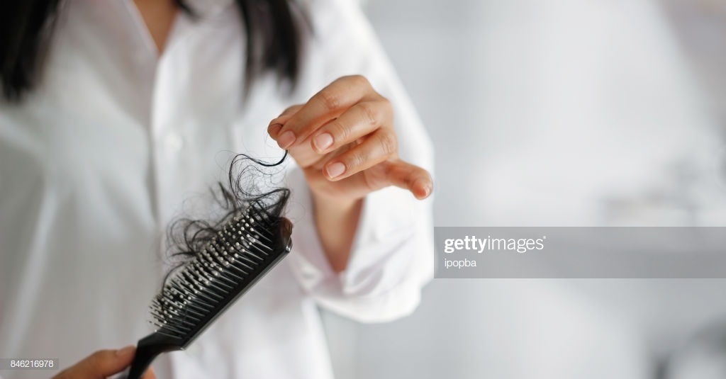 Woman Losing Hair On Hairbrush In Hand Bathroom Background High