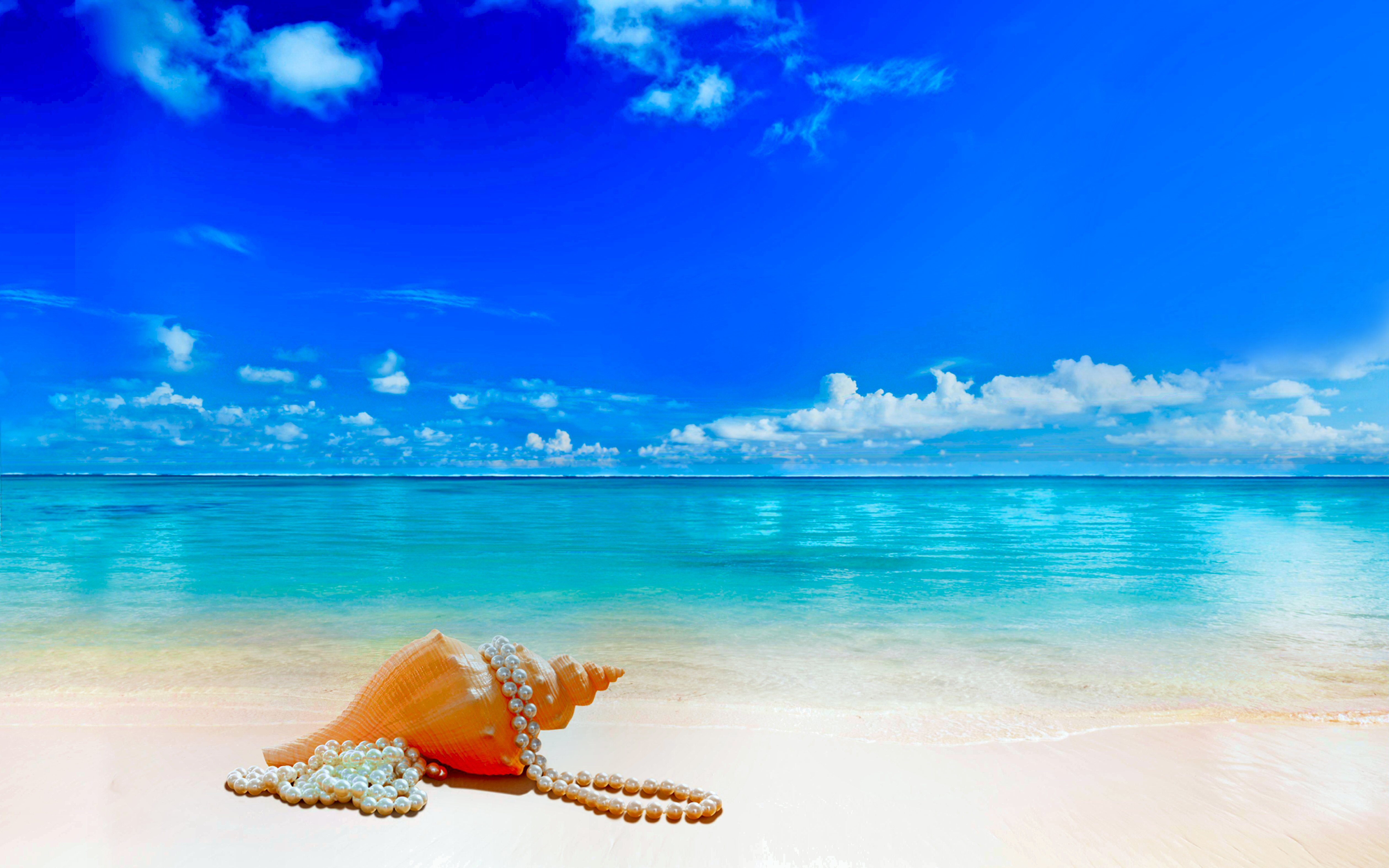 A pristine beach with turquoise water, a conch shell, and a pearl necklace under a vibrant blue sky